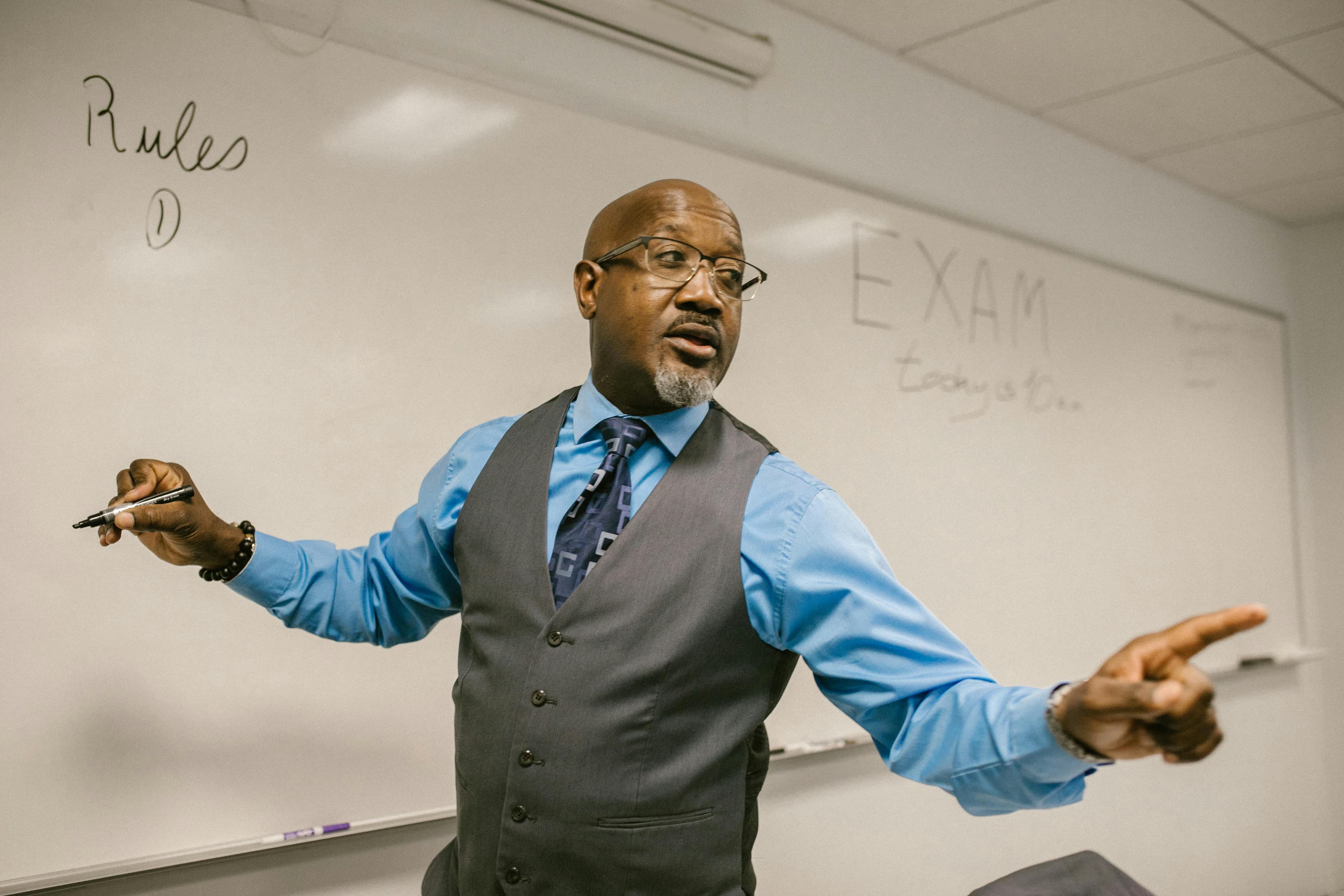 Educator guiding students in discussion